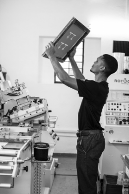 Photo of man looking screen printing process at Label Mountain