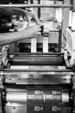Close-Up photo of man setting up printer at Label Mountain